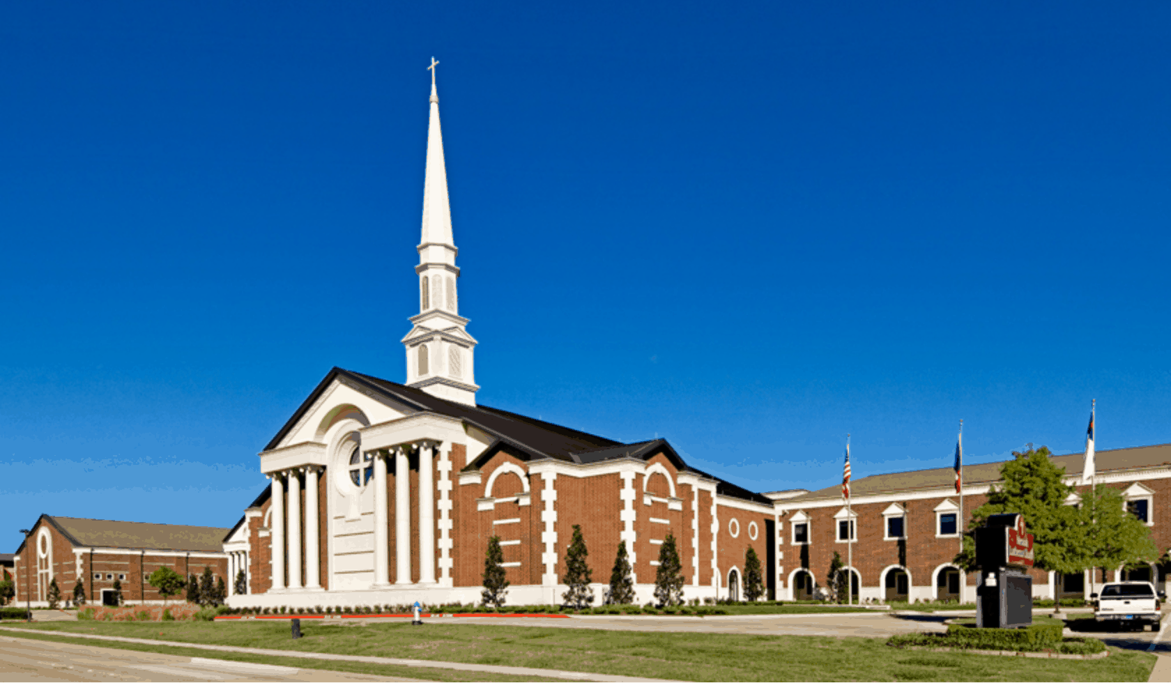 Front view of Messiah Lutheran grounds, with the center focus on the main building with tall white steeple