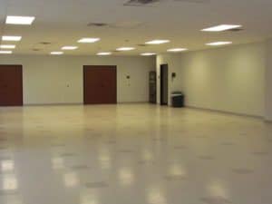 Large empty white tiled room